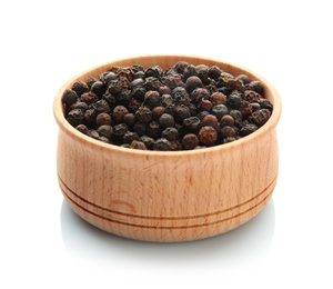 Wooden bowl with black pepper grains on white background