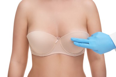 Photo of Mammologist checking woman's breast on white background, closeup