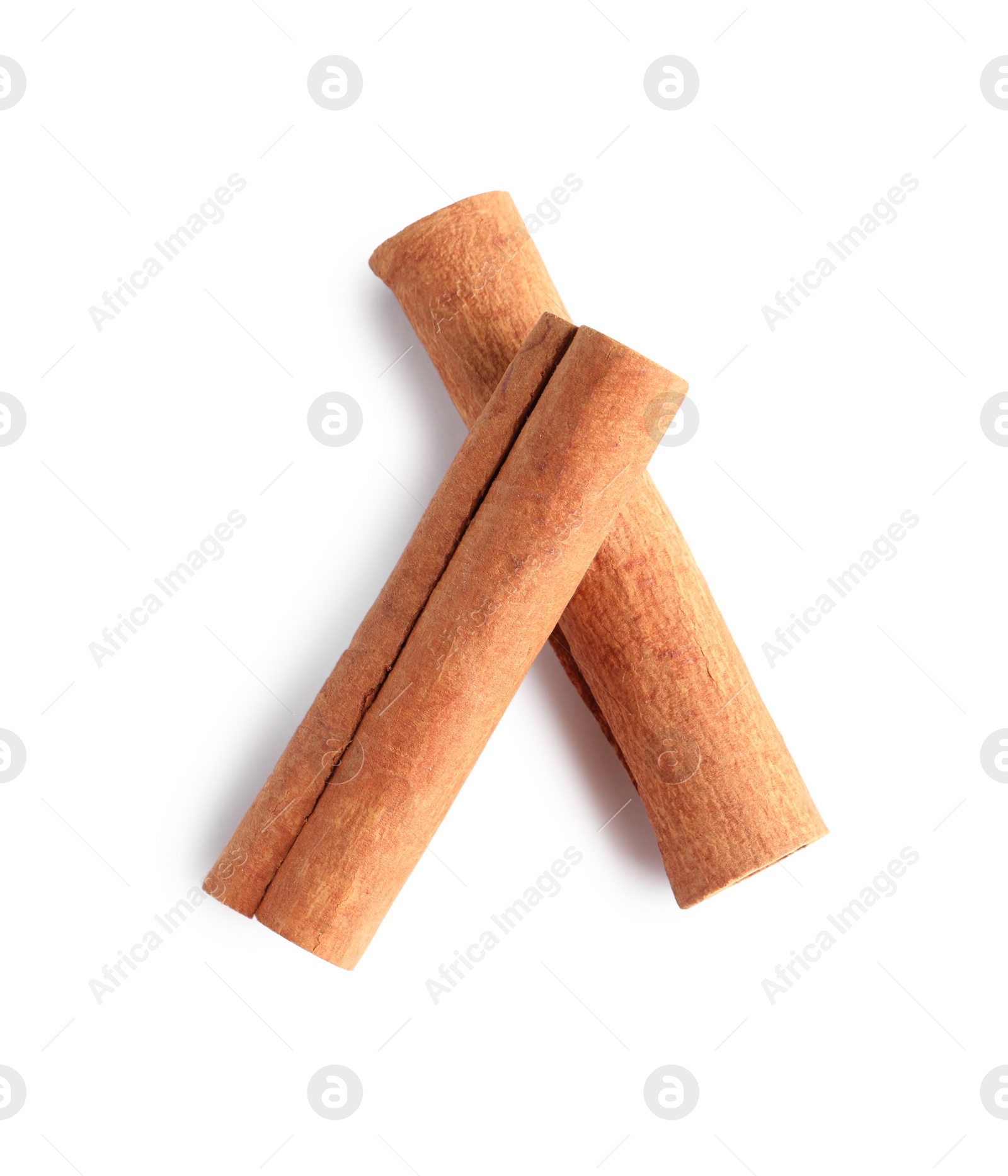 Photo of Cinnamon sticks isolated on white, top view