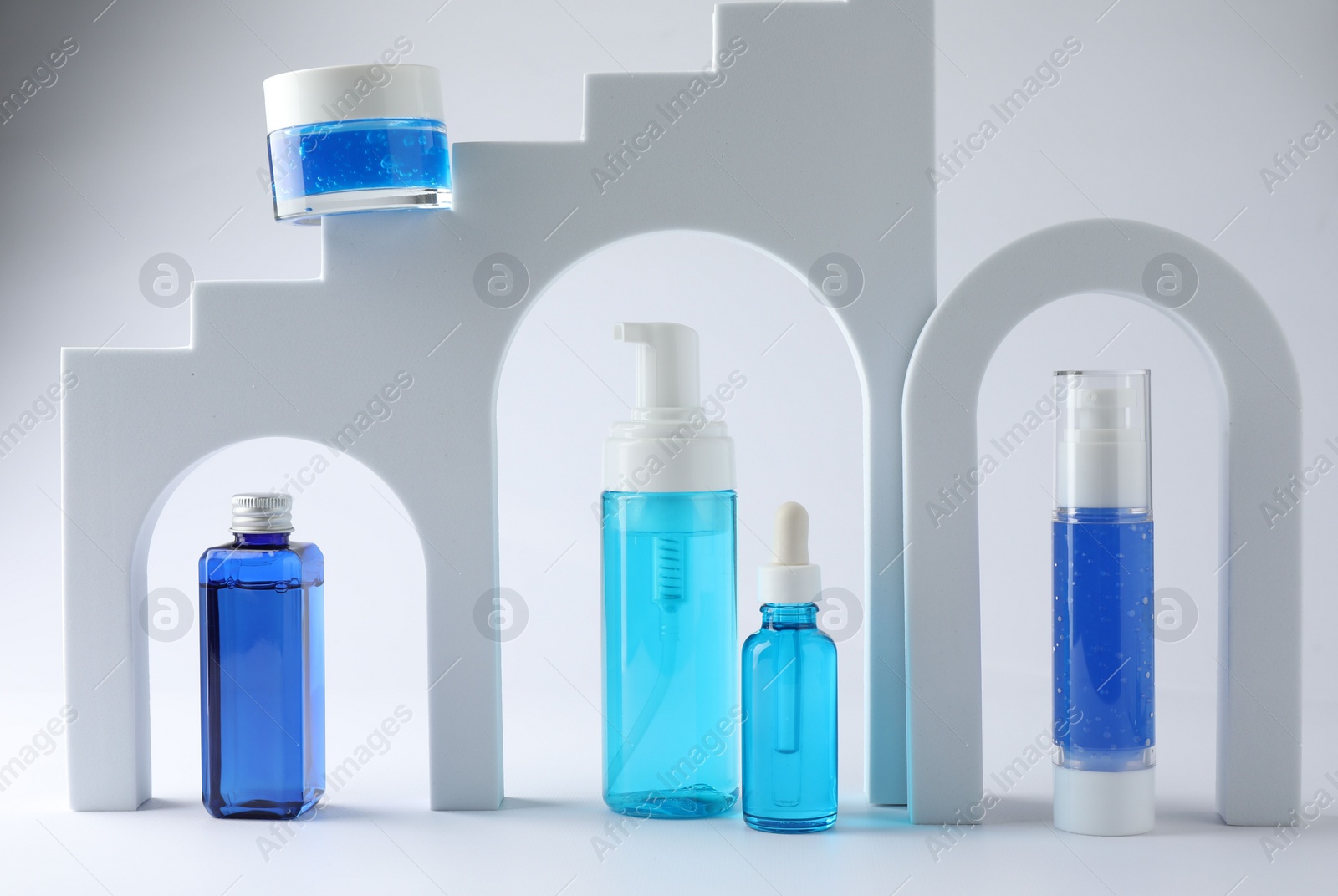 Photo of Stylish presentation of luxury cosmetic products on white background