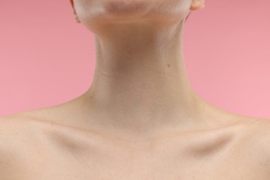 Beauty concept. Woman on pink background, closeup