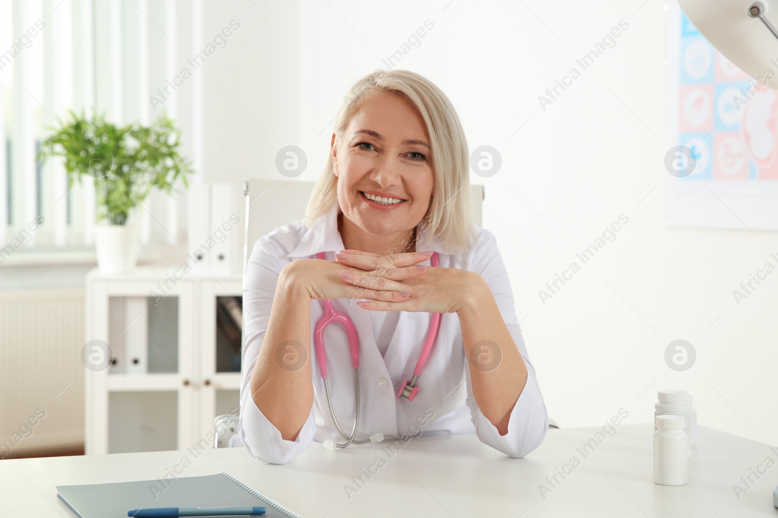 Photo of Doctor consulting patient using video chat in clinic, view from web camera