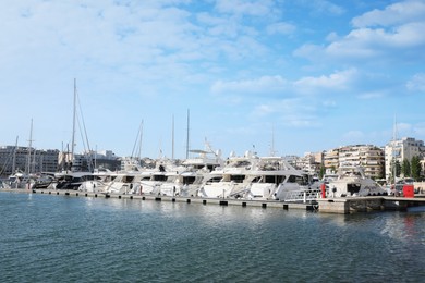 Photo of Picturesque view of port with modern boats on sunny day