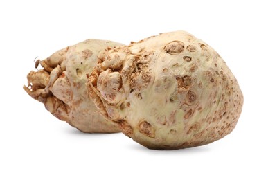Photo of Fresh raw celery roots isolated on white