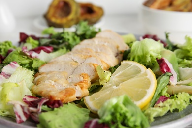 Photo of Tasty cooked chicken fillet with fresh salad, closeup. Healthy meals from air fryer