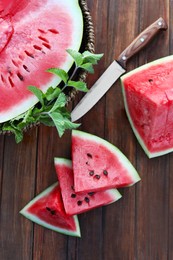 Photo of Flat lay composition with tasty ripe watermelon on wooden table