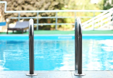 Photo of Modern swimming pool with stairs at resort