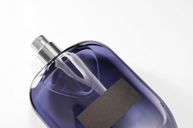 Photo of Luxury men`s perfume in bottle on white background, top view