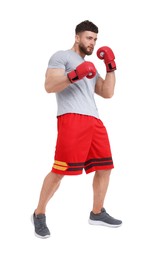 Photo of Man in boxing gloves fighting on white background