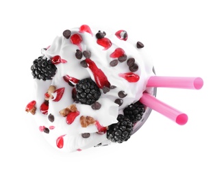 Photo of Tasty milk shake with blackberries in glass on white background, top view