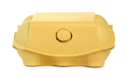 Photo of One yellow egg carton isolated on white