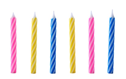 Photo of Set of colorful striped birthday candles isolated on white