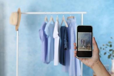 Photo of Blogger taking photo of stylish clothes indoors, closeup. Space for text