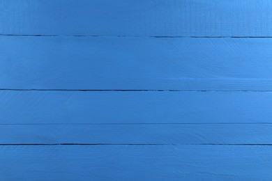 Photo of Texture of dark blue wooden surface as background, closeup