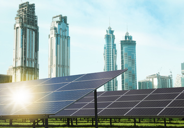 Image of Cityscape and solar panels installed outdoors. Alternative energy source