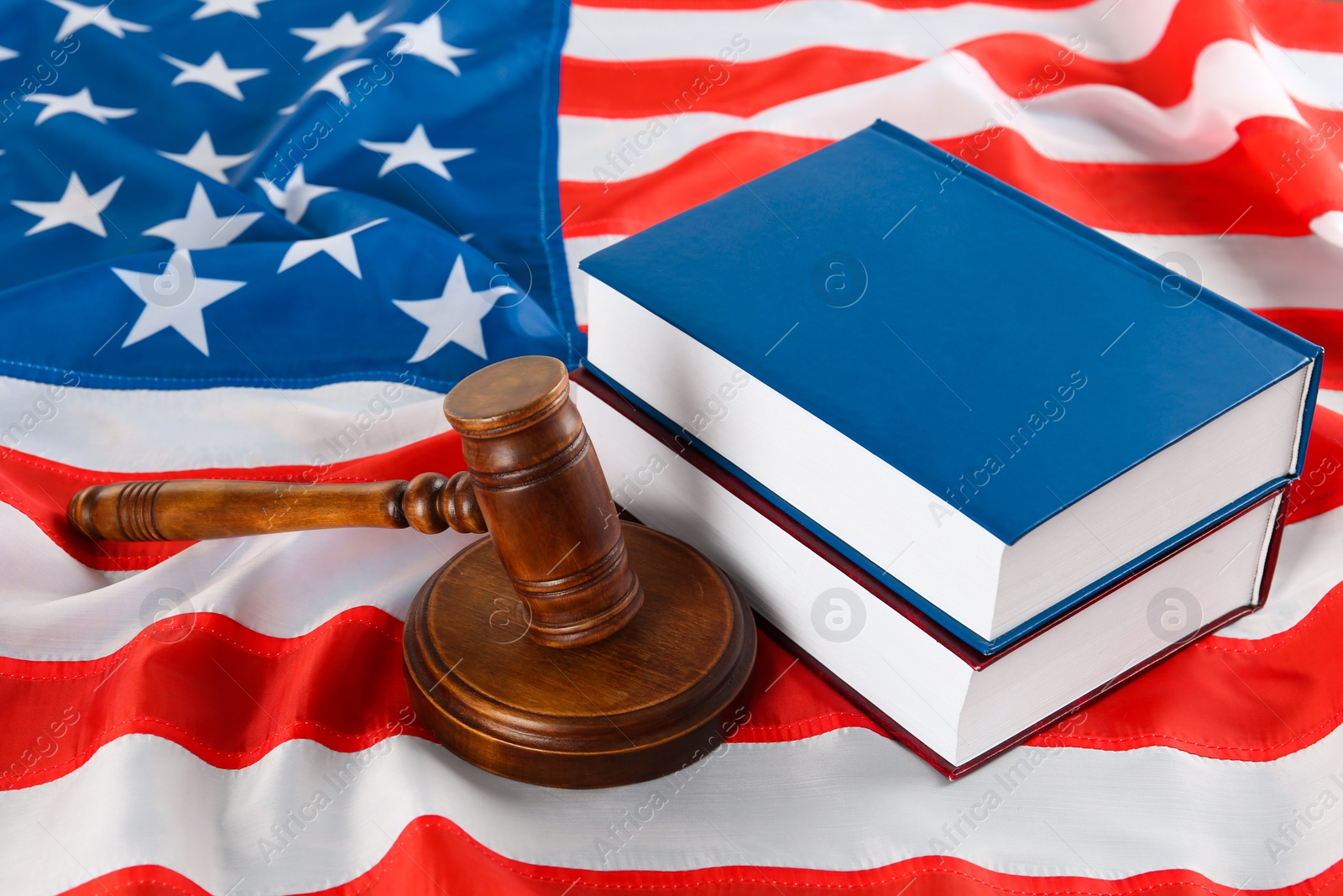 Photo of Judge's gavel and books on American flag