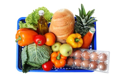 Photo of Shopping basket with grocery products on white background, top view