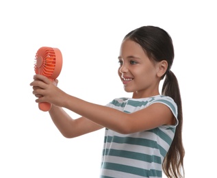 Photo of Little girl enjoying air flow from portable fan on white background. Summer heat