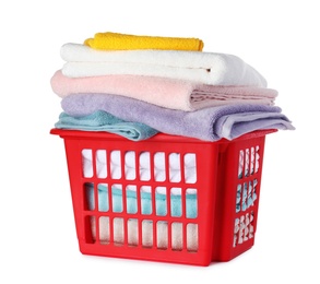 Photo of Plastic laundry basket with clean towels on white background