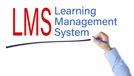 Image of Man underlining text Learning Management System and its abbreviation LMS on white board, closeup