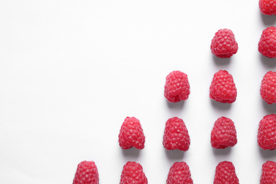 Photo of Fresh sweet ripe raspberries on white background,flat lay. Space for text