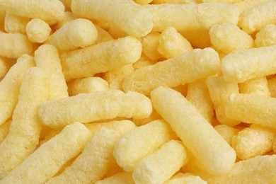 Photo of Tasty sweet corn sticks as background, closeup