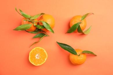 Photo of Flat lay composition with ripe tangerines on color background