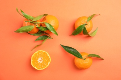 Flat lay composition with ripe tangerines on color background