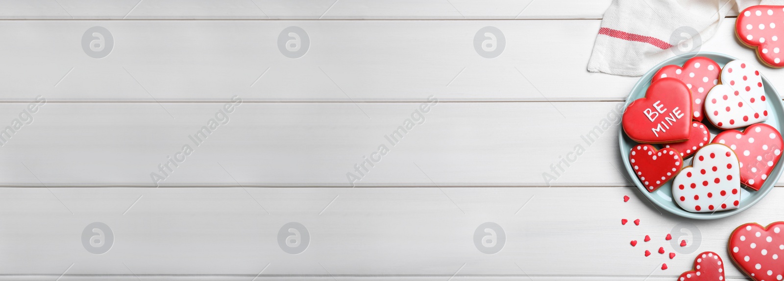 Image of Heart shaped cookies on white wooden table, flat lay with space for text. Valentine's Day banner design