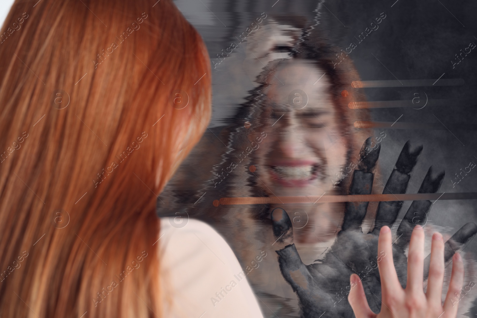 Image of Emotional young woman suffering from hallucinations. Hand touching broken mirror on backside, glitch effect