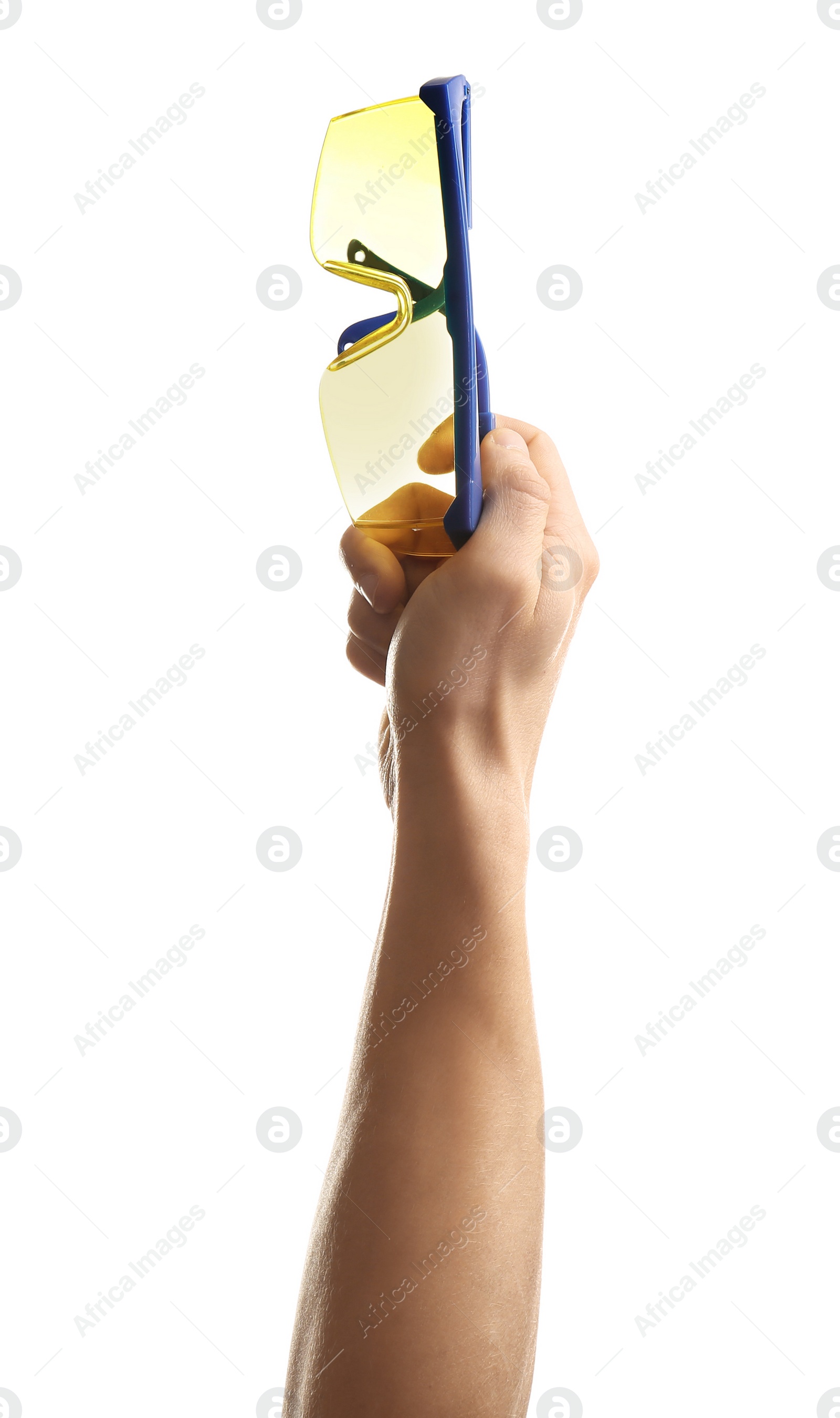 Photo of Man holding protective goggles on white background. Construction tools