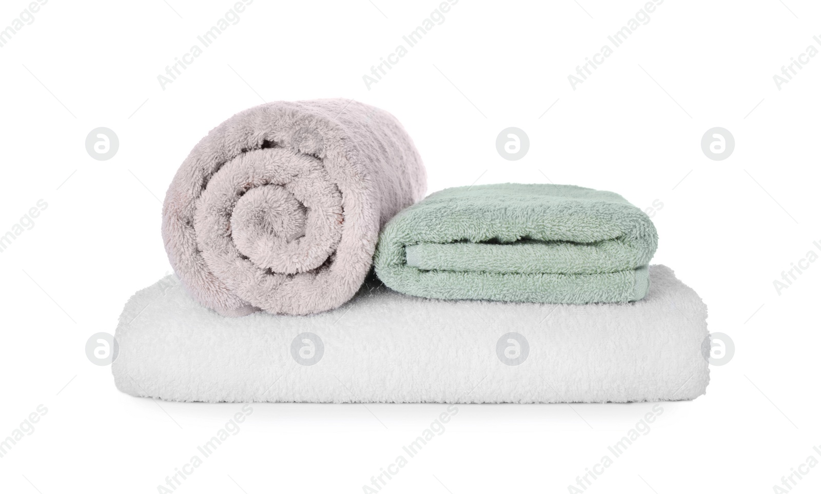 Photo of Fresh clean towels for bathroom on white background