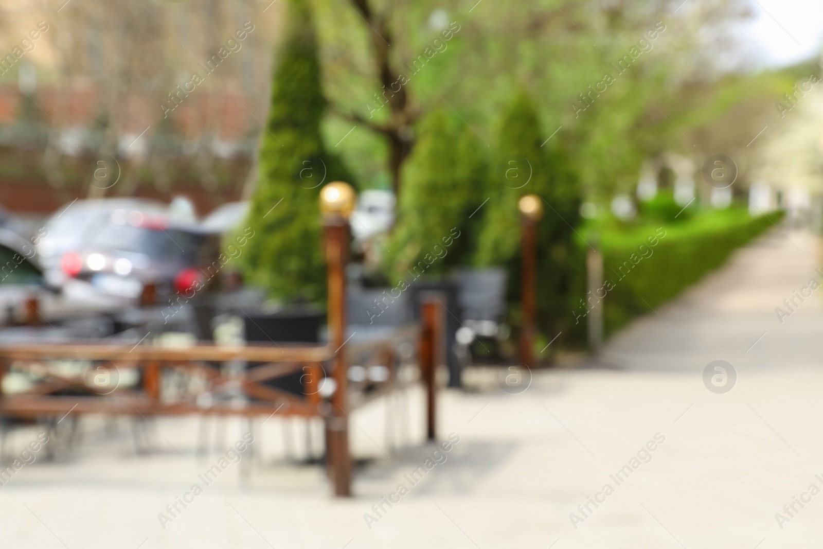 Photo of Blurred view of outdoor cafe terrace on city street