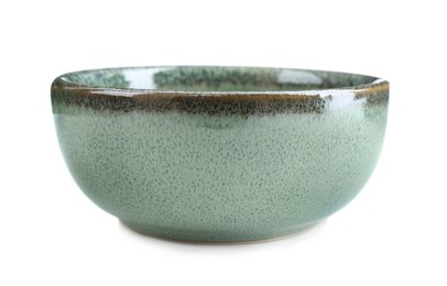 Beautiful green ceramic bowl on white background