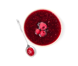 Bowl and spoon with delicious raspberry jam on white background