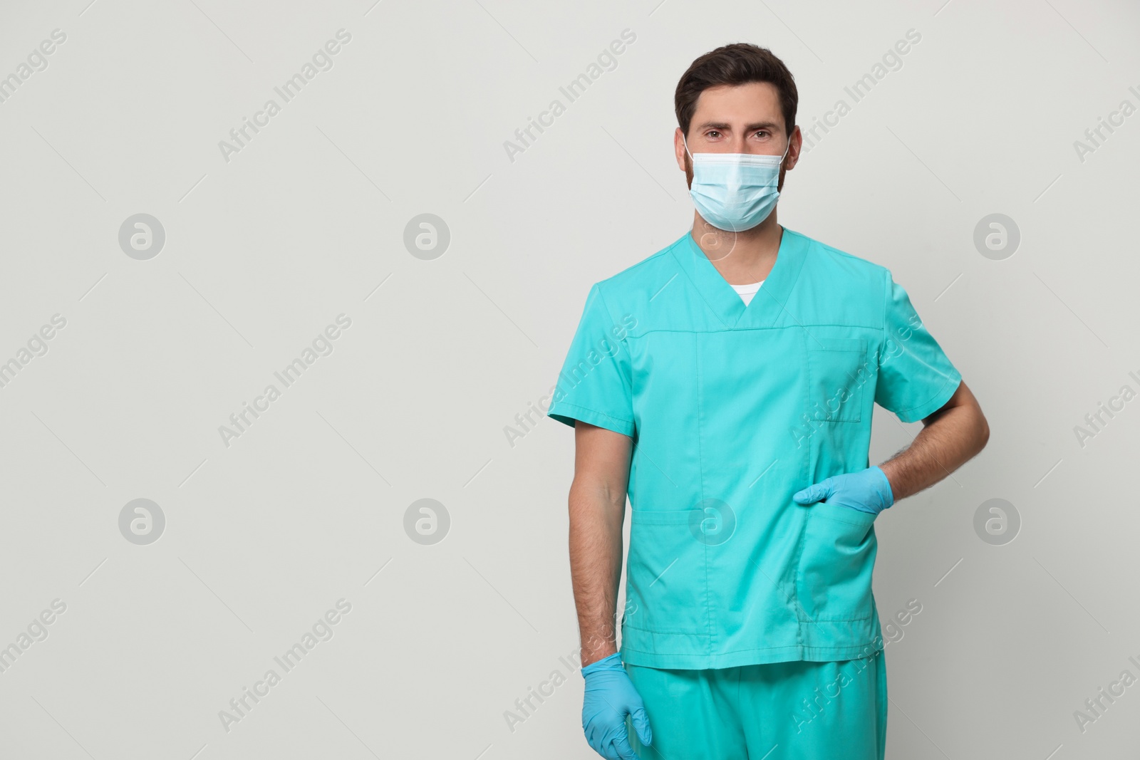 Photo of Nurse with medical mask on white background, space for text