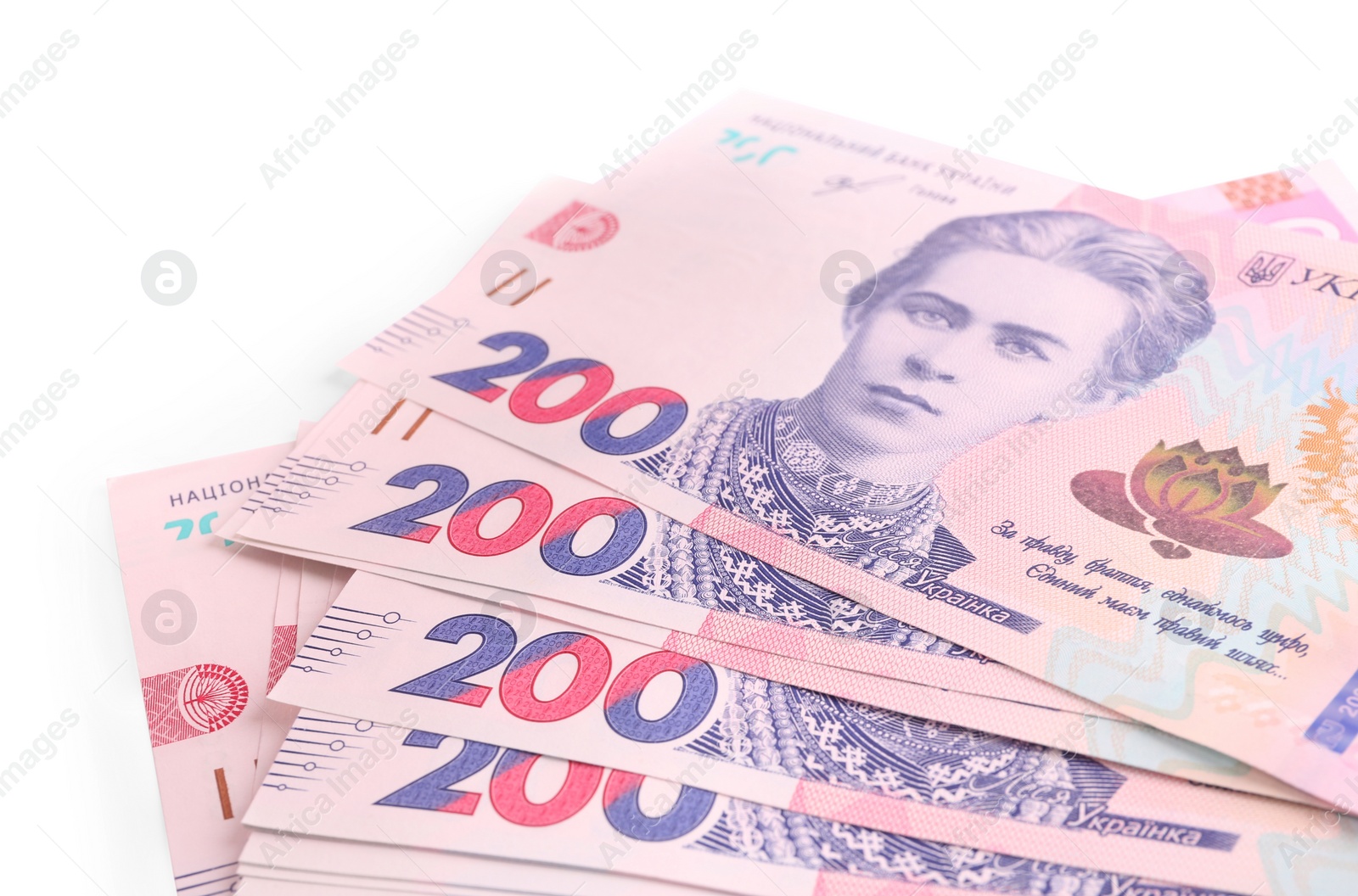 Photo of 200 Ukrainian Hryvnia banknotes on white background, closeup