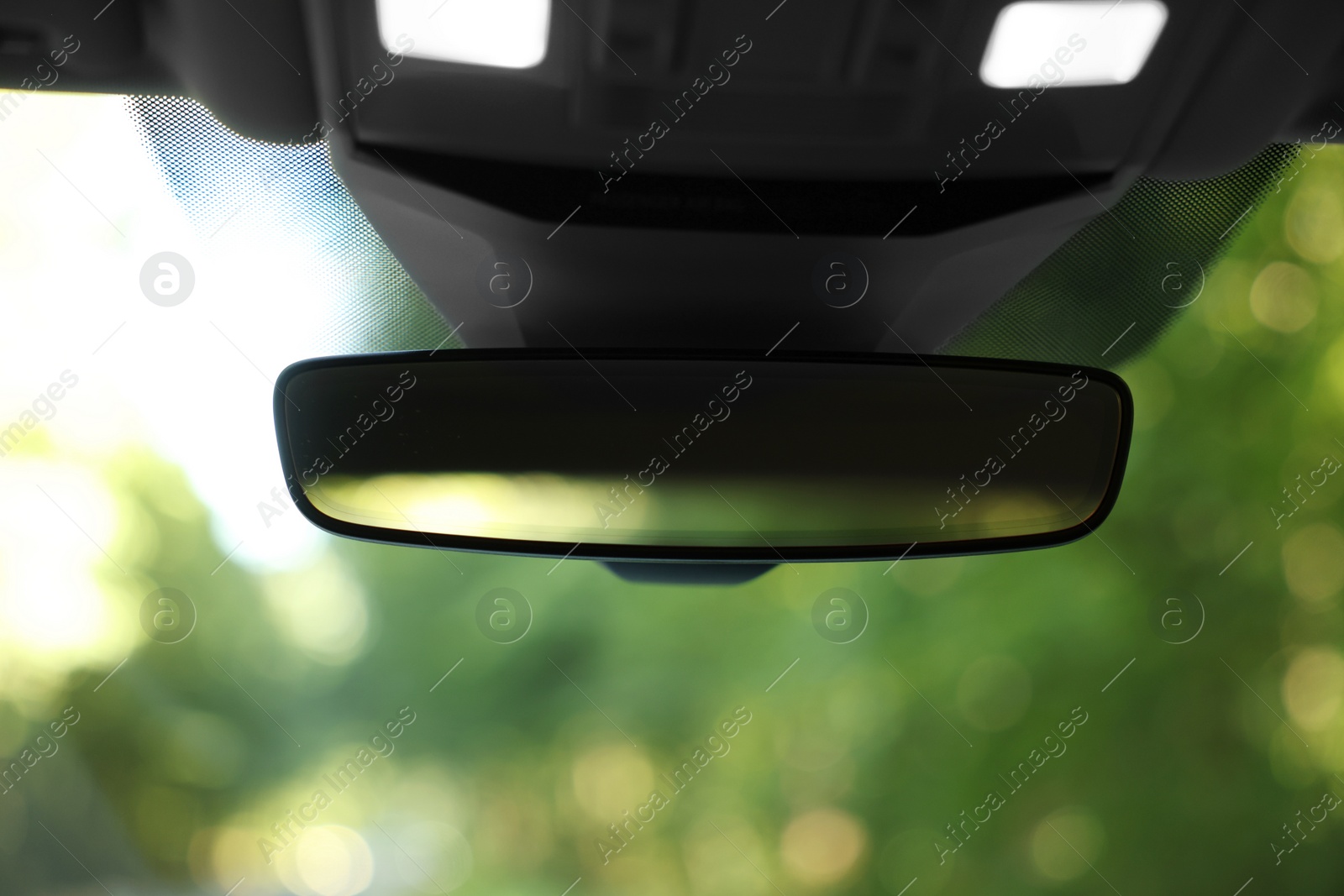 Photo of Clean rear view mirror in car, closeup