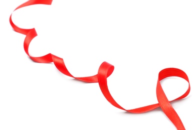 Photo of Simple red ribbon on white background, closeup