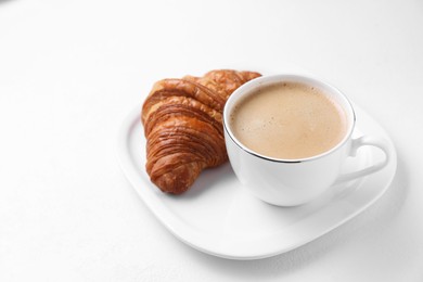 Photo of Breakfast time. Fresh croissant and coffee on white background. Space for text