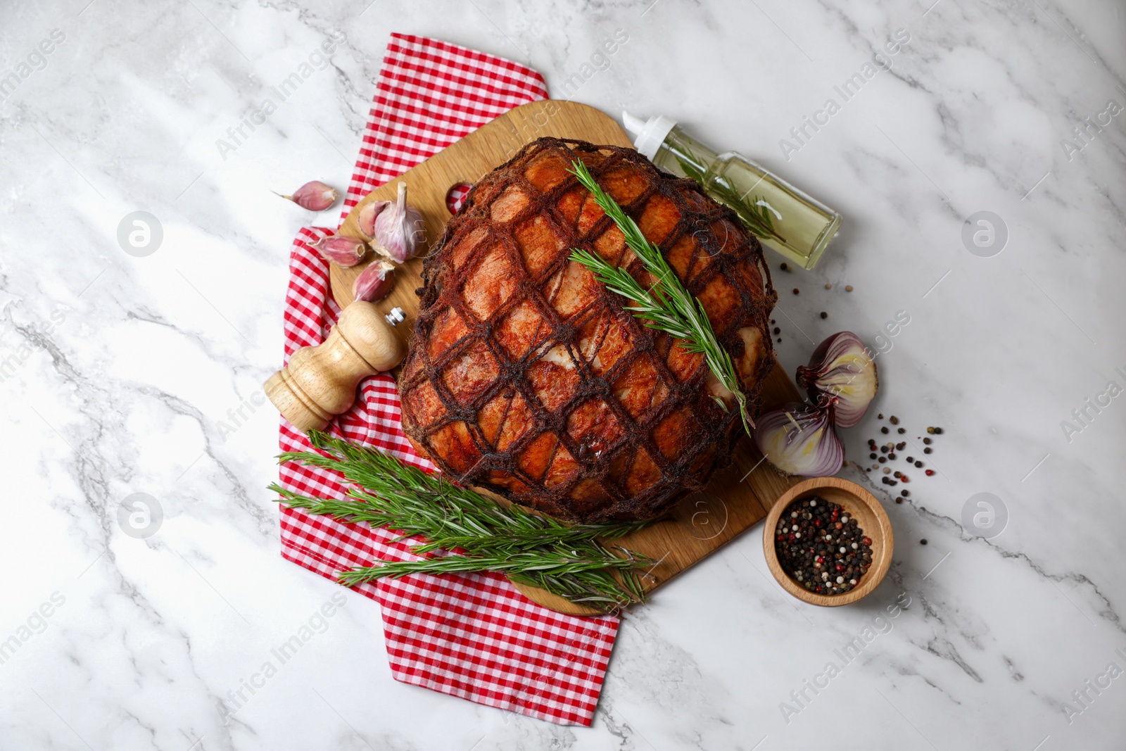 Photo of Delicious baked ham served on white marble table, flat lay