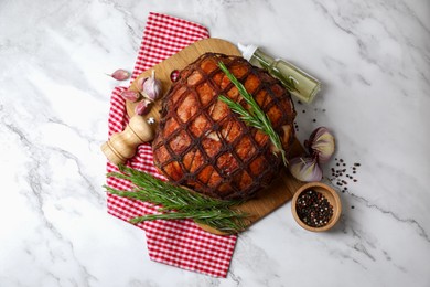 Delicious baked ham served on white marble table, flat lay