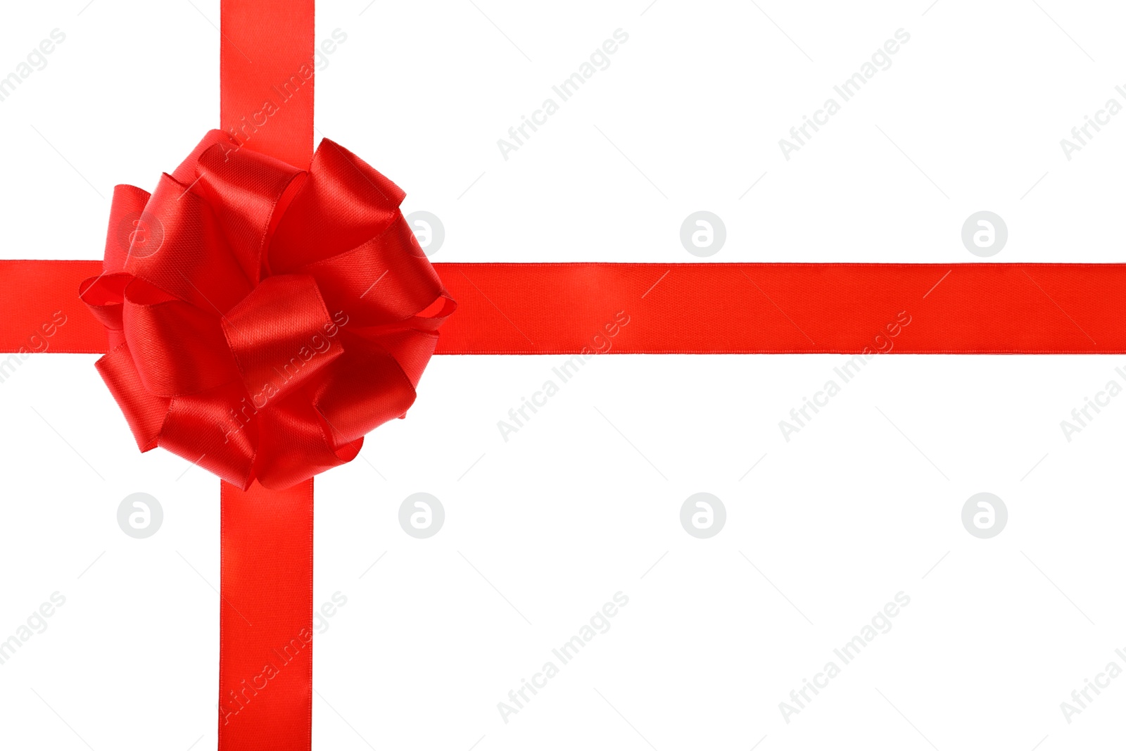 Photo of Red ribbon with bow on white background. Festive decoration