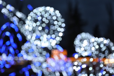 Photo of Beautiful bright Christmas decor outdoors. Bokeh effect