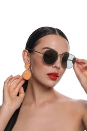 Photo of Attractive woman wearing fashionable sunglasses against white background