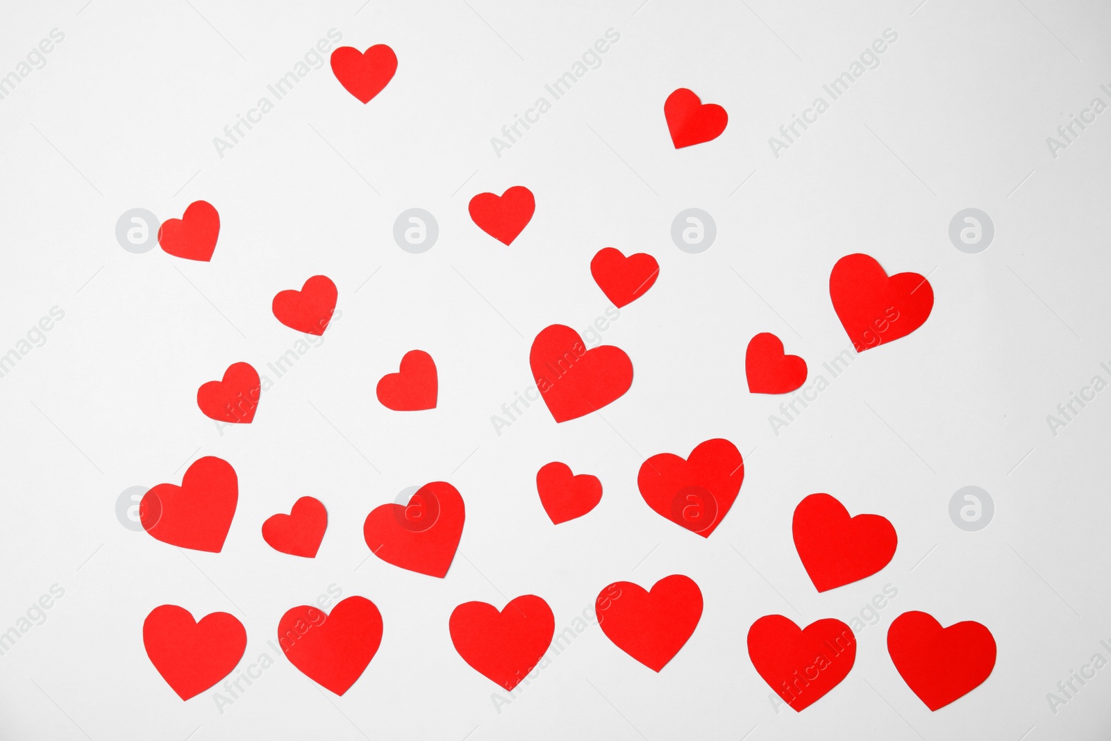 Photo of Small paper hearts on white background