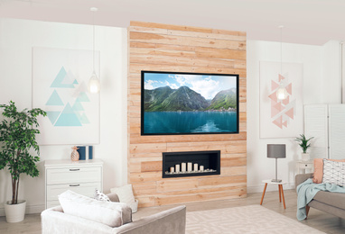 Living room interior with modern TV on wooden wall