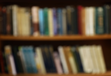 Blurred view of cabinet with books in library