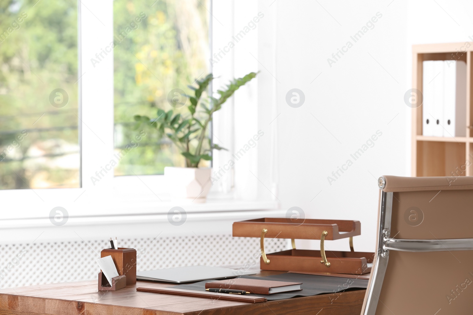 Photo of Wooden table with stationery in lawyer's office