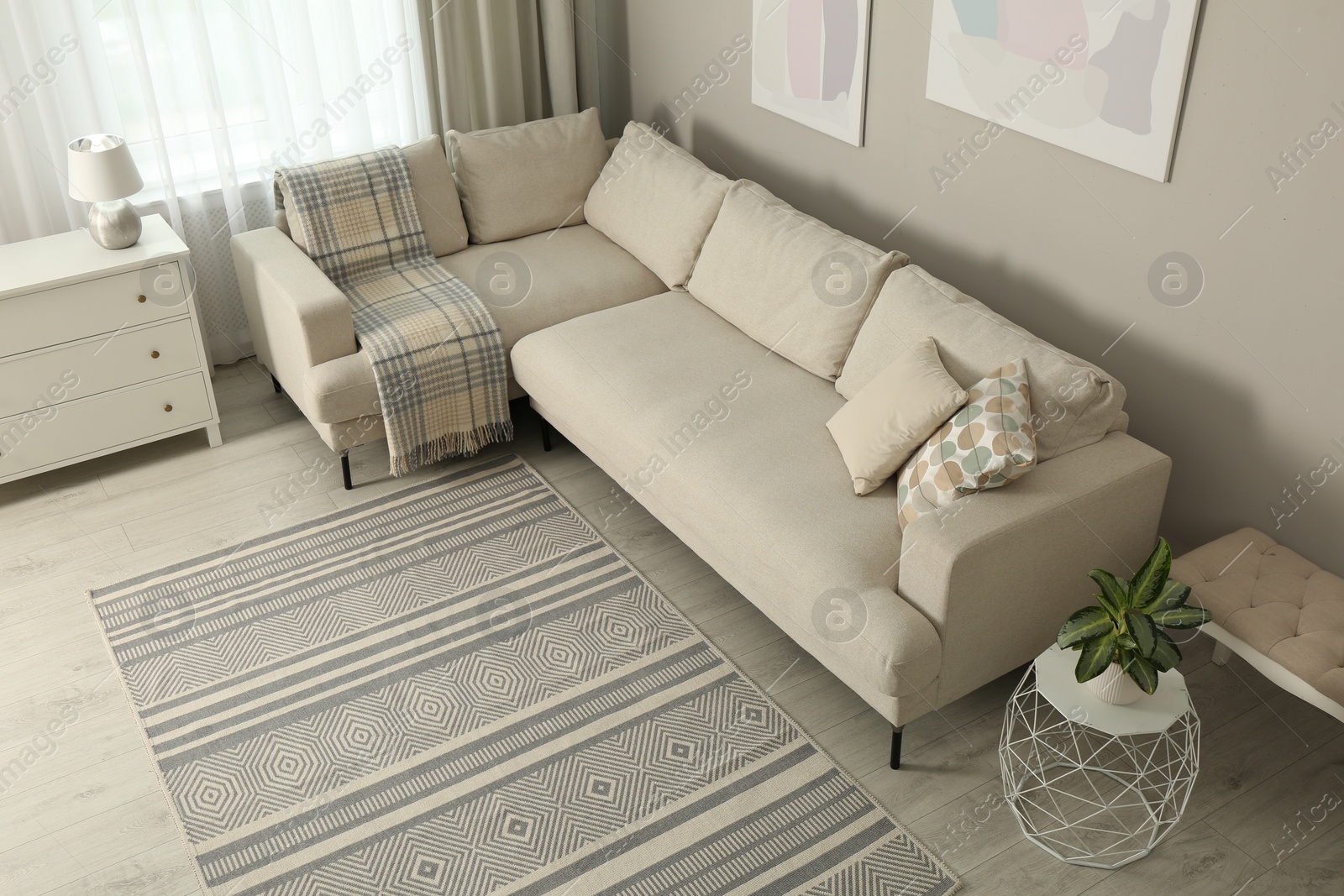 Photo of Living room interior with stylish rug and furniture, above view